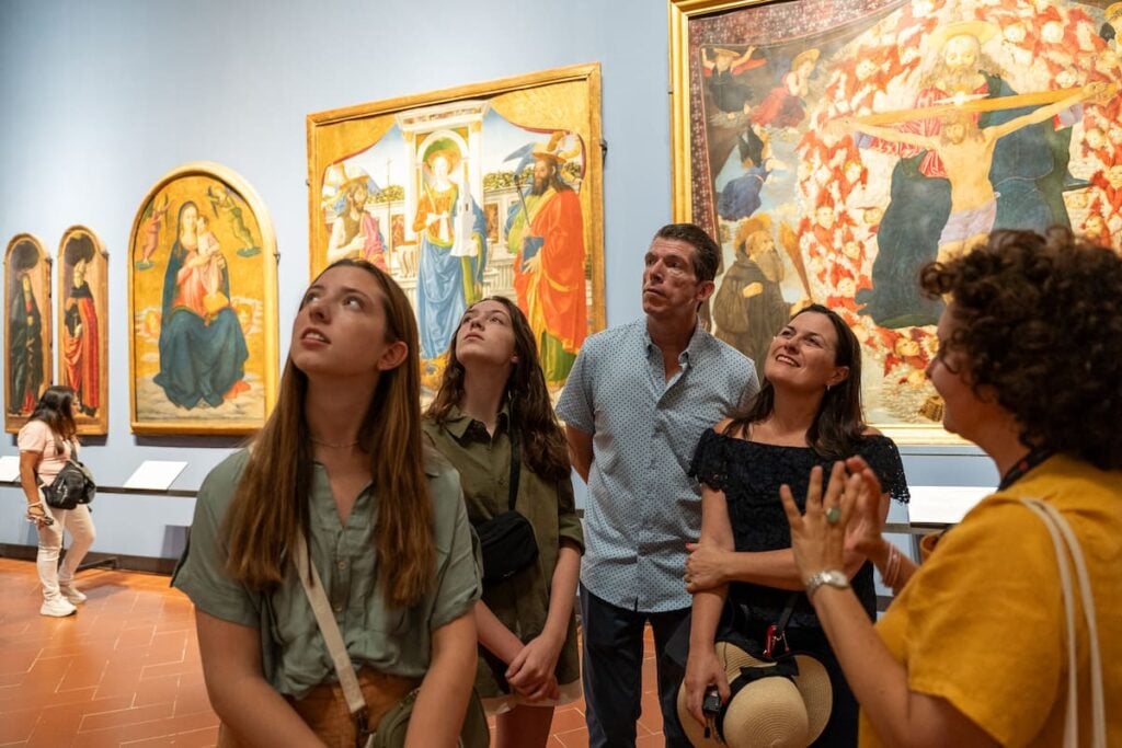 guide and small group inside the Accademia Gallery in Florence