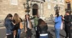 a group of tourists with a guide in Barcelona