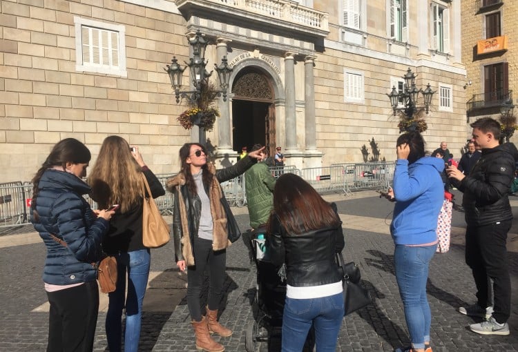 a group of tourists with a guide in Barcelona