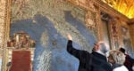 a man points at a map of Italy