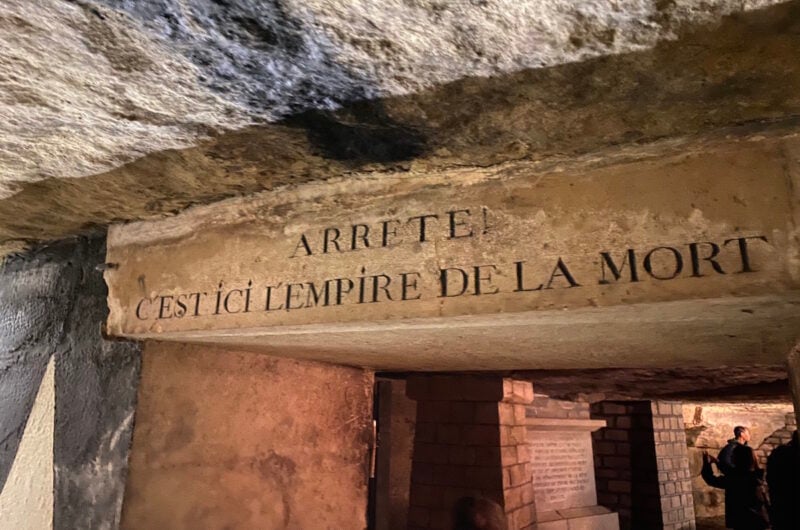 an inscription on a stone above a doorway