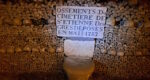 an inscription on a block surrounded by many skulls