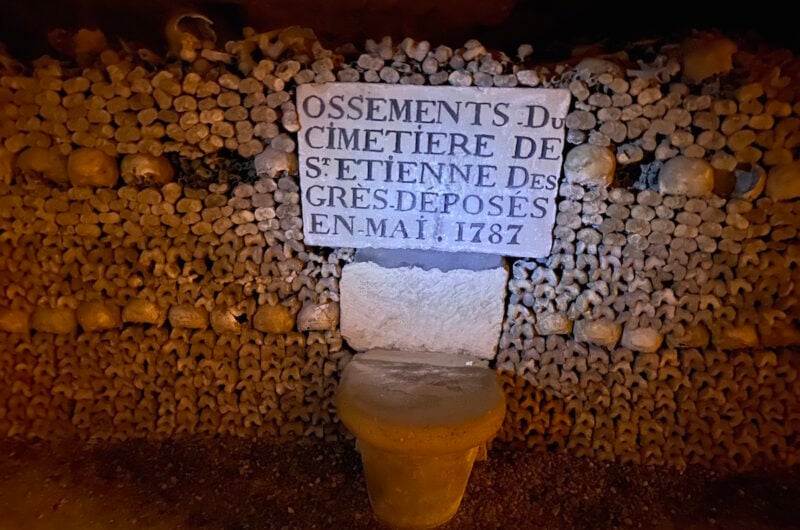 an inscription on a block surrounded by many skulls