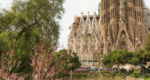 A lake in front of a huge church with many spires