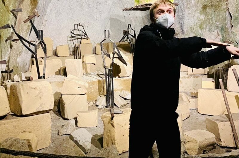 a person standing in front of some cardboard boxed
