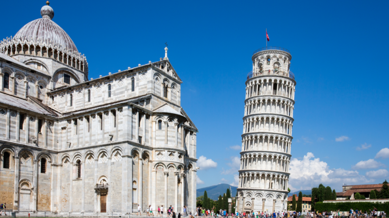 a learning tower next to a church