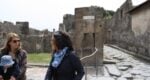 woman standing in the ruins
