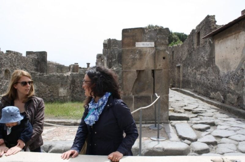 woman standing in the ruins