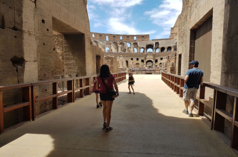 a person entering the arena at the Colosseum in Rome