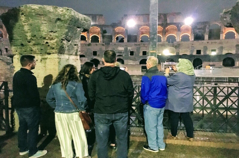 a group of people inside an ancient amphitheater