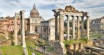 a view of ancient ruins of temples and arches in the Roman Forum