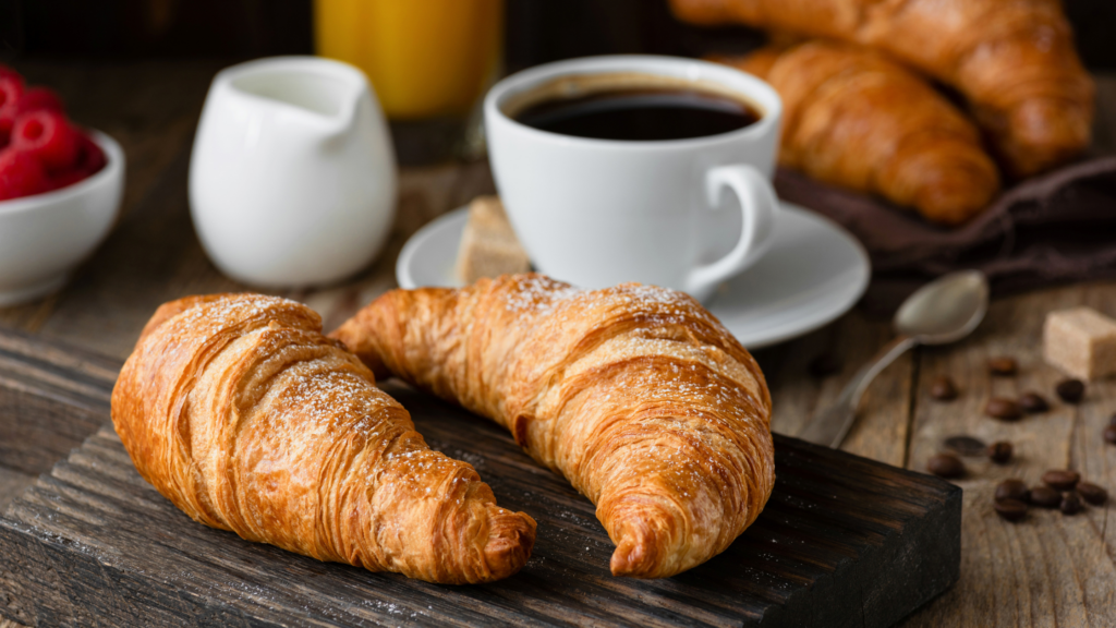 2 croissants and a cup of coffee in Paris