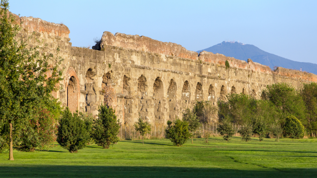 An ancient Roman aqueduct in a park in Rome