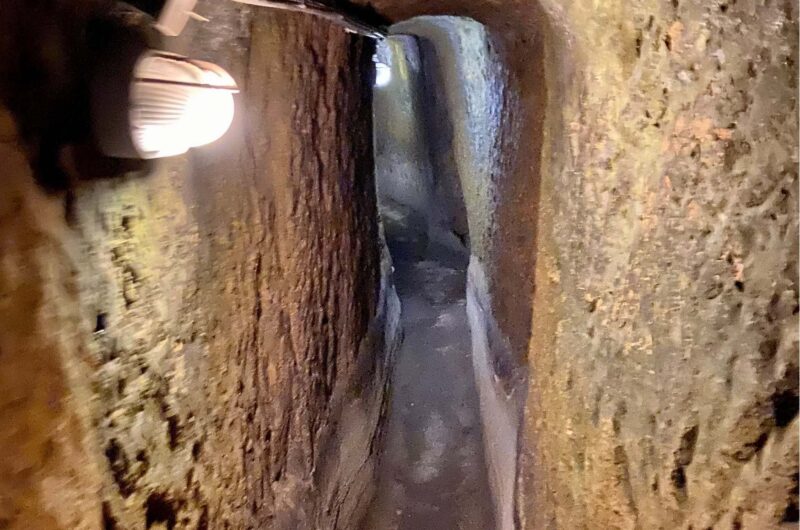a narrow passage carved underground