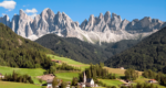 a small village surrounded by green with the Dolomite Mountains behind