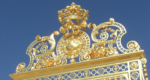The golden entrance gates of the Palace of Versailles
