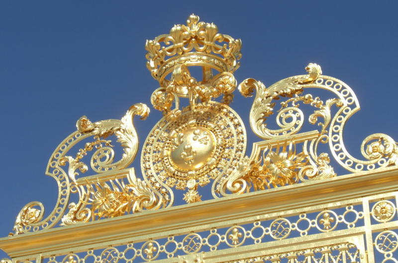 The golden entrance gates of the Palace of Versailles