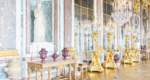 The Hall of Mirrors, Versailles. Large gold candlesticks in front of a wall of mirrors