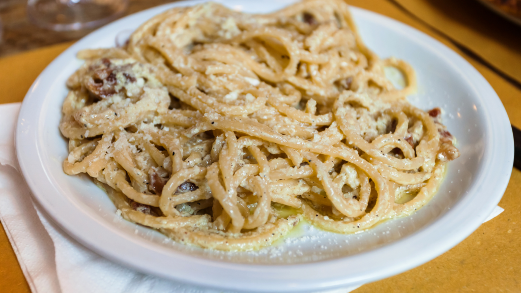 a plate of carbonara pasta