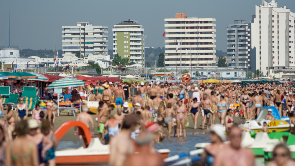 a beach with lots of people in summer