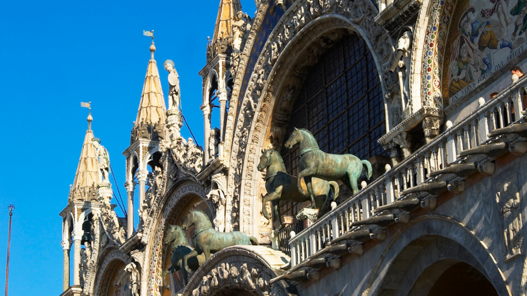 4 metal horses decorating a church