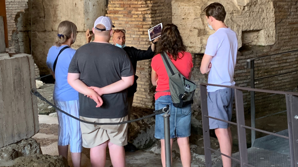 a group of people with a tour guide