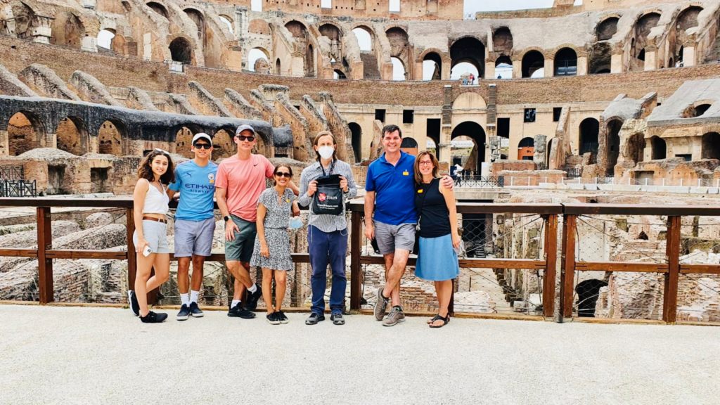 a happy group of people inside an ancient amphitheatre