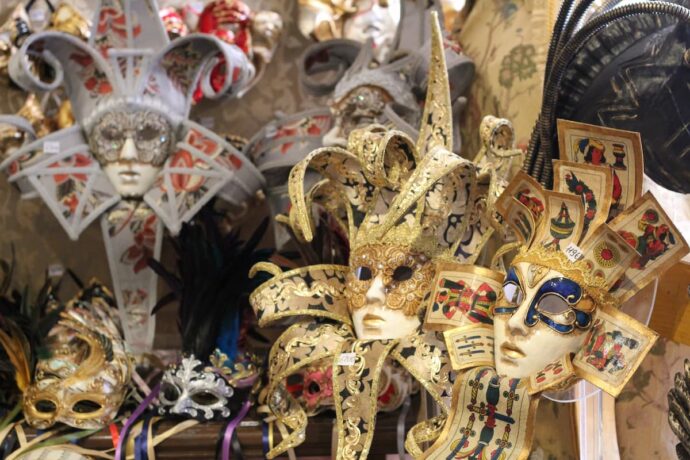 the carnival masks of Venice on display in a shop