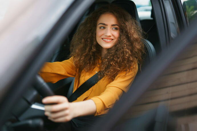 Woman driving with an international drivers permit in Europe